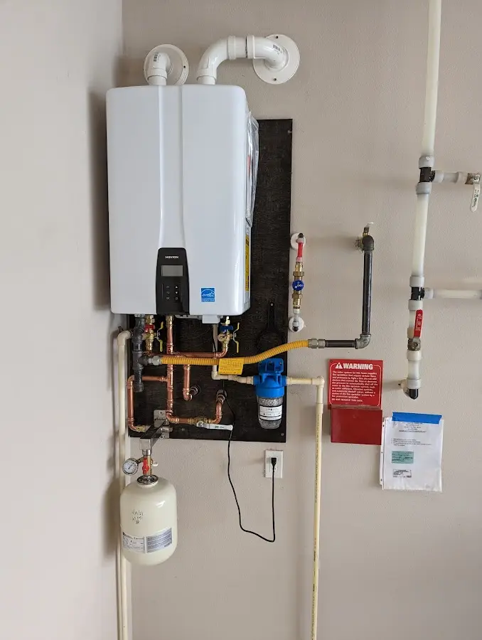 Professional plumber installing copper piping in a Oakley home